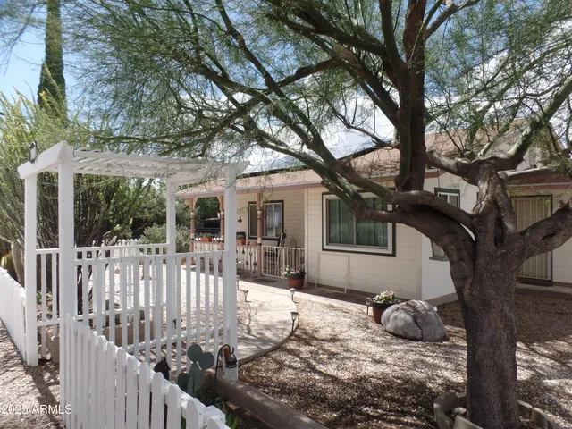 a house with trees in front of it