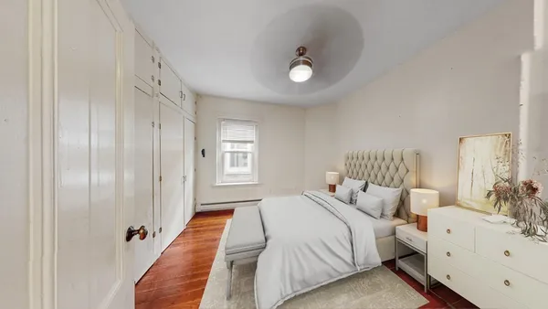 a bedroom with bed and window