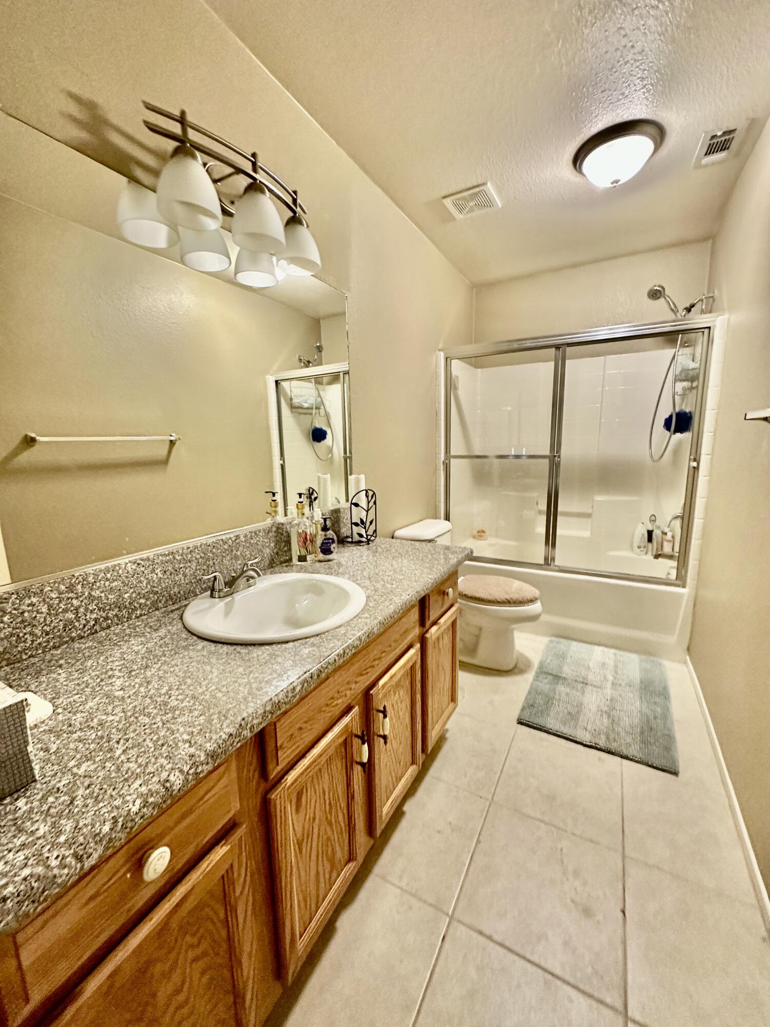 2175 Hidden Spring Blythe, CA 92225 - Photo 6 of 10 a bathroom with a granite countertop sink and a mirror