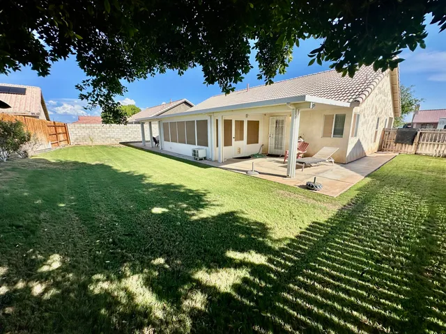 a front view of a house with garden and porch