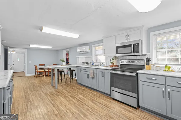 a kitchen with lots of counter top space and appliances
