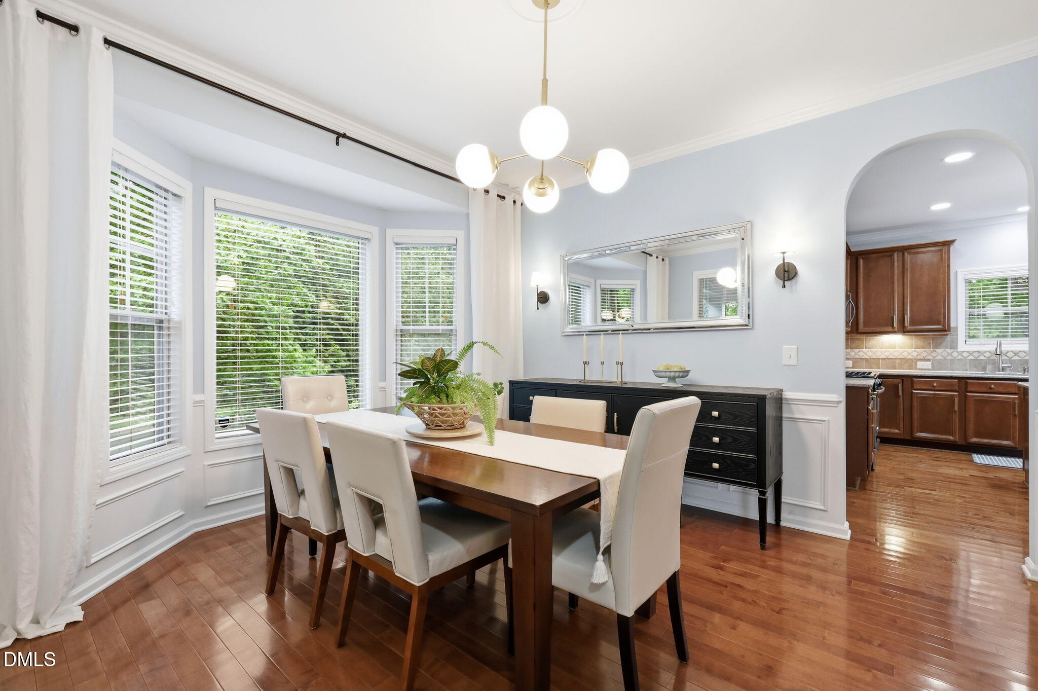162 Gathering Place Durham, NC 27713 - Photo 5 of 52 a view of a dining room with furniture window and wooden floor