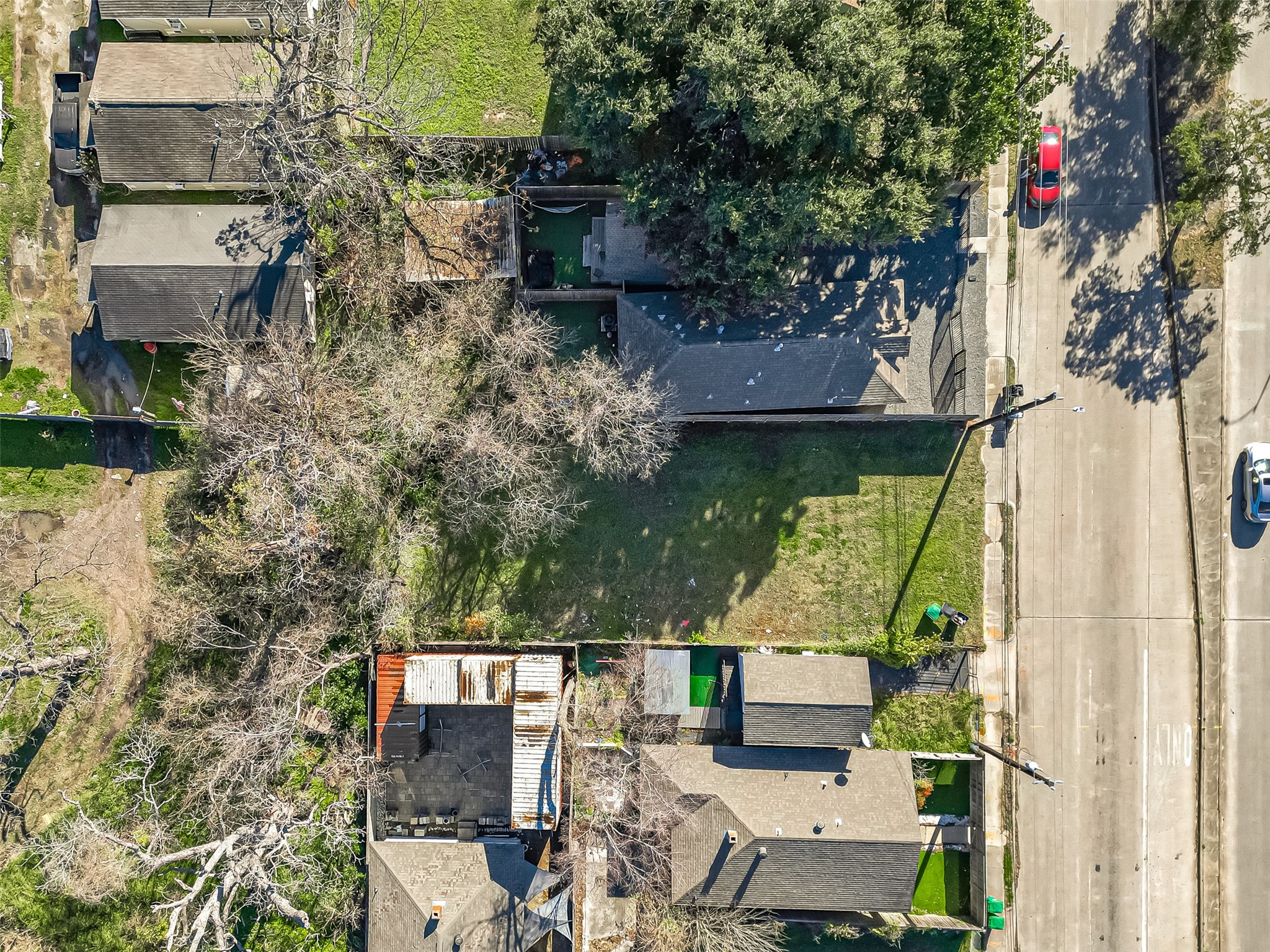 2407 Alabama Street Houston, TX 77004 - Photo 8 of 29 an aerial view of a house with a garden and lake view