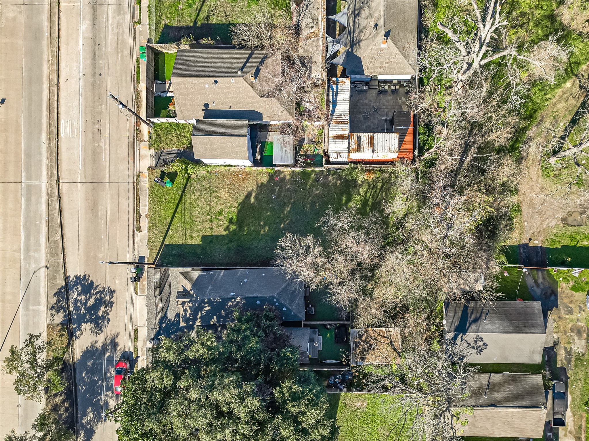 2407 Alabama Street Houston, TX 77004 - Photo 9 of 29 an aerial view of a house with a yard and garden