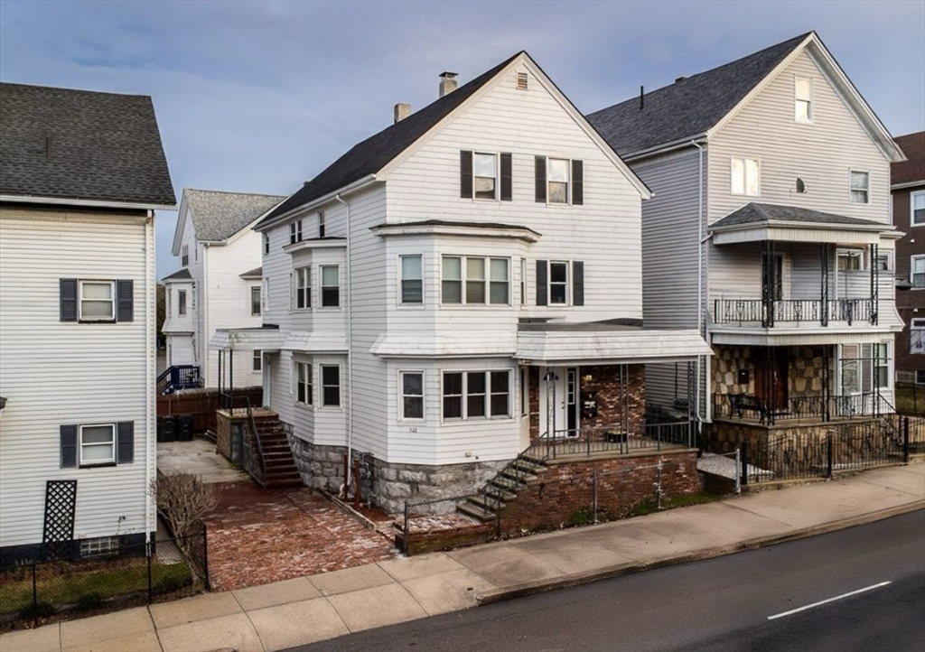 522 Broadway Fall River, MA 02724 - Photo 1 of 15 a view of a white building among the street with large windows