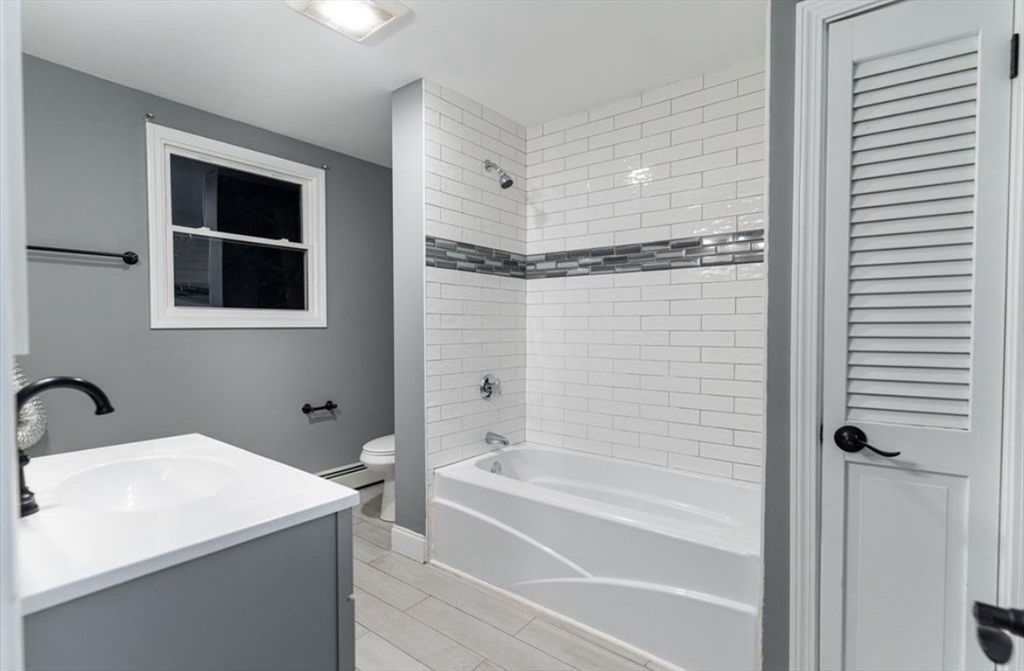 522 Broadway Fall River, MA 02724 - Photo 13 of 15 a bathroom with a bathtub and a shower