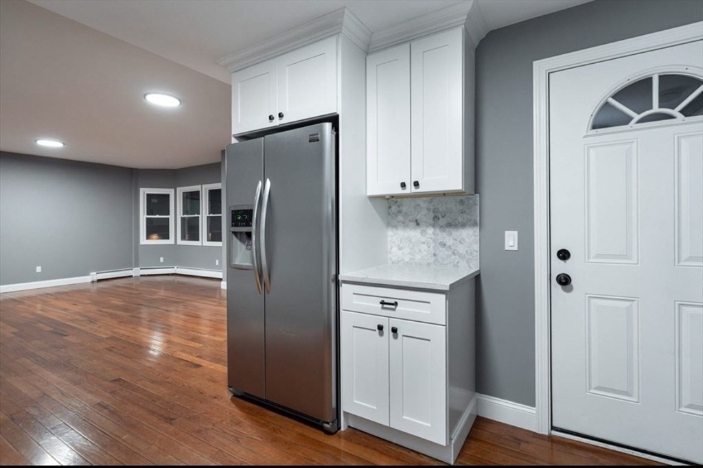 522 Broadway Fall River, MA 02724 - Photo 5 of 15 a kitchen with stainless steel appliances granite countertop a refrigerator and a sink