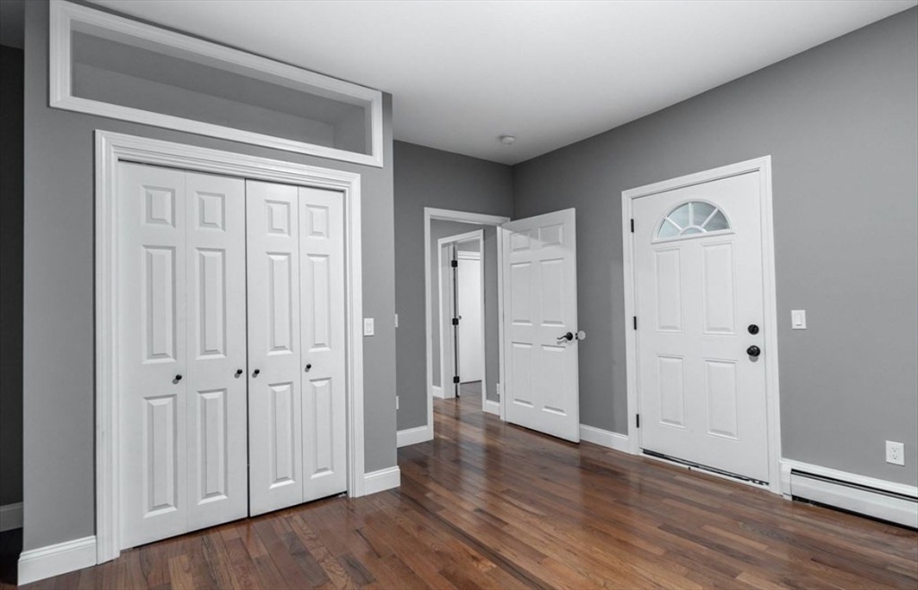 522 Broadway Fall River, MA 02724 - Photo 10 of 15 a view of a hallway with wooden floor