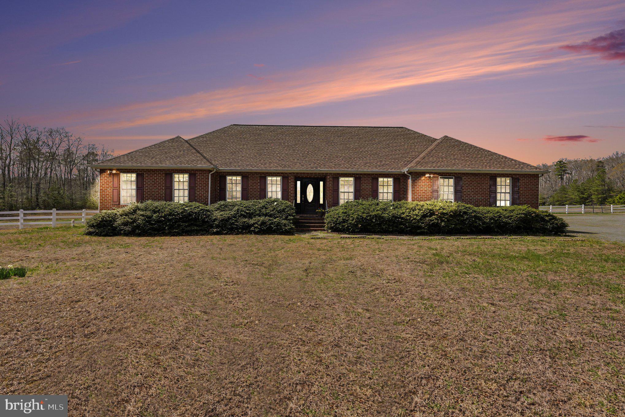 2383 Rappahannock Road Colonial Beach, VA 22443 - Photo 48 of 52 a front view of a house with a garden