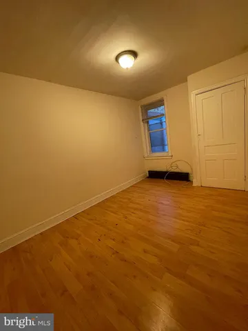 an empty room with a empty space and mirror