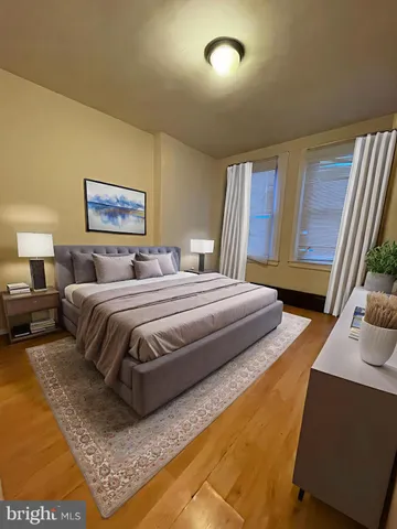 a bedroom with bed and window