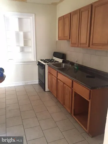 a kitchen with a cabinets and appliances