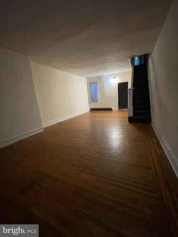 a view of a livingroom with wooden floor