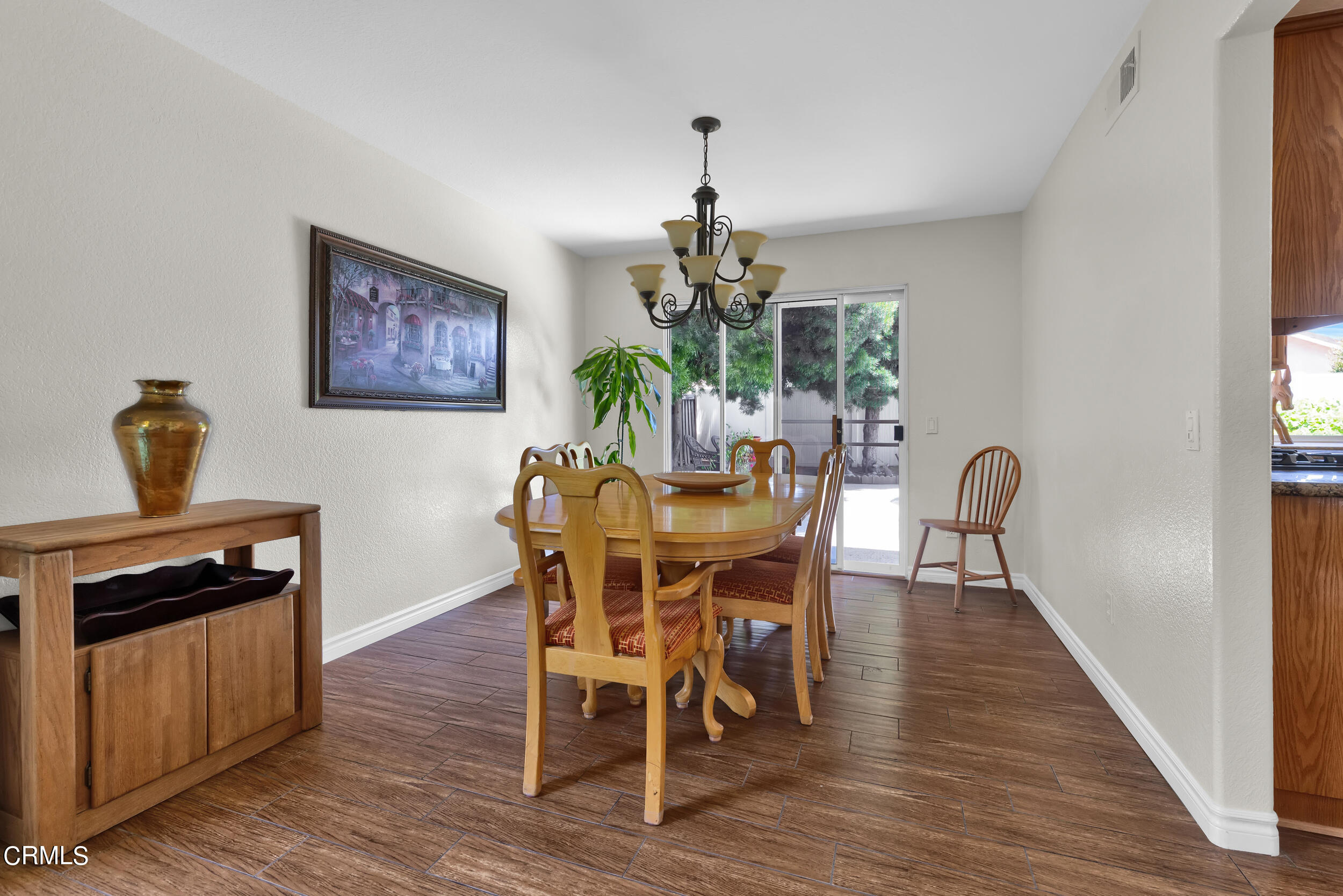 20182 Hill Spring Road Wildomar, CA 92595 - Photo 11 of 47 a view of a dining room with furniture window and wooden floor