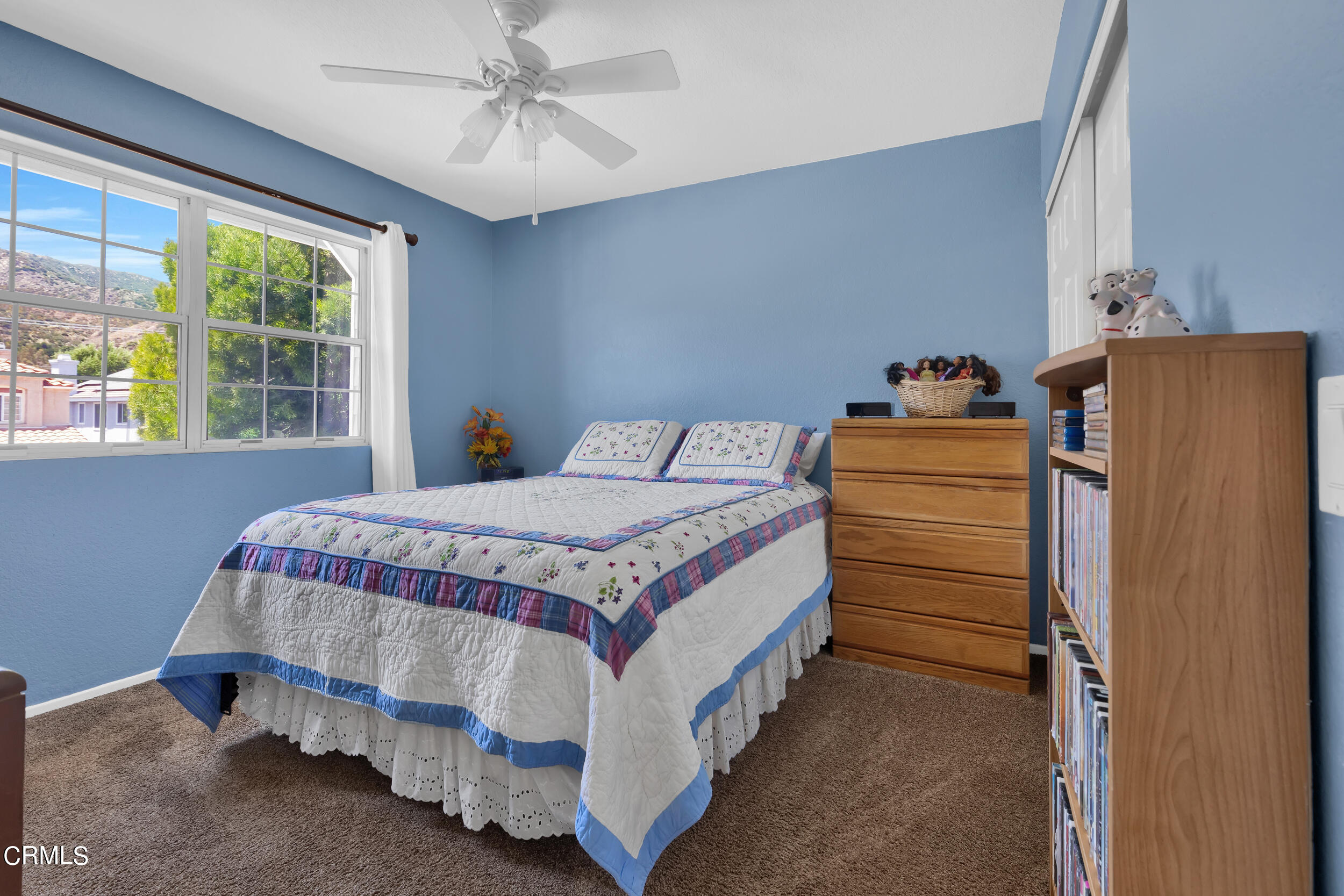 20182 Hill Spring Road Wildomar, CA 92595 - Photo 28 of 47 a bedroom with a bed and a dresser