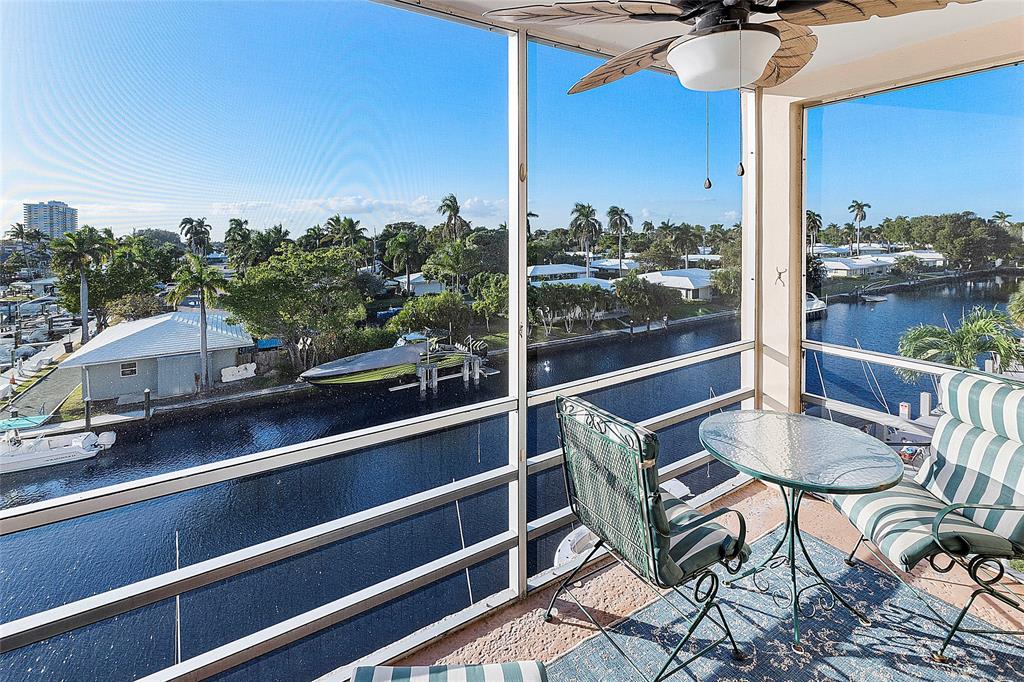 1481 South Ocean Boulevard, Unit 416A Lauderdale-by-the-Sea, FL 33062 - Photo 1 of 16 a view of a balcony with chair and table