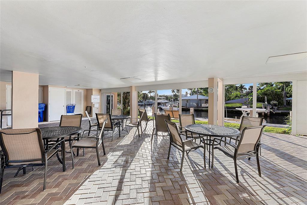 1481 South Ocean Boulevard, Unit 416A Lauderdale-by-the-Sea, FL 33062 - Photo 13 of 16 a dining room with furniture and wooden floor