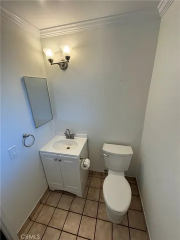 a bathroom with a sink toilet and mirror