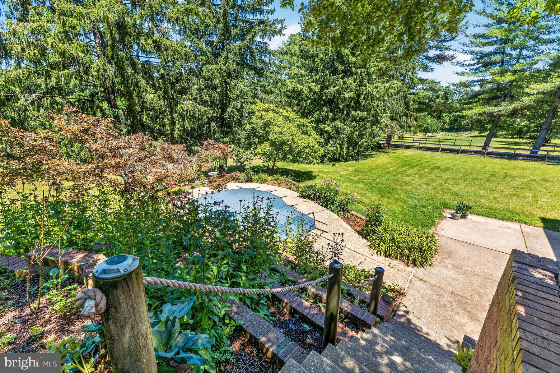 328 Sansbury Road Friendship, MD 20758 - Photo 13 of 35 Stairs to upper patio from Large In-Ground Jacuzzi