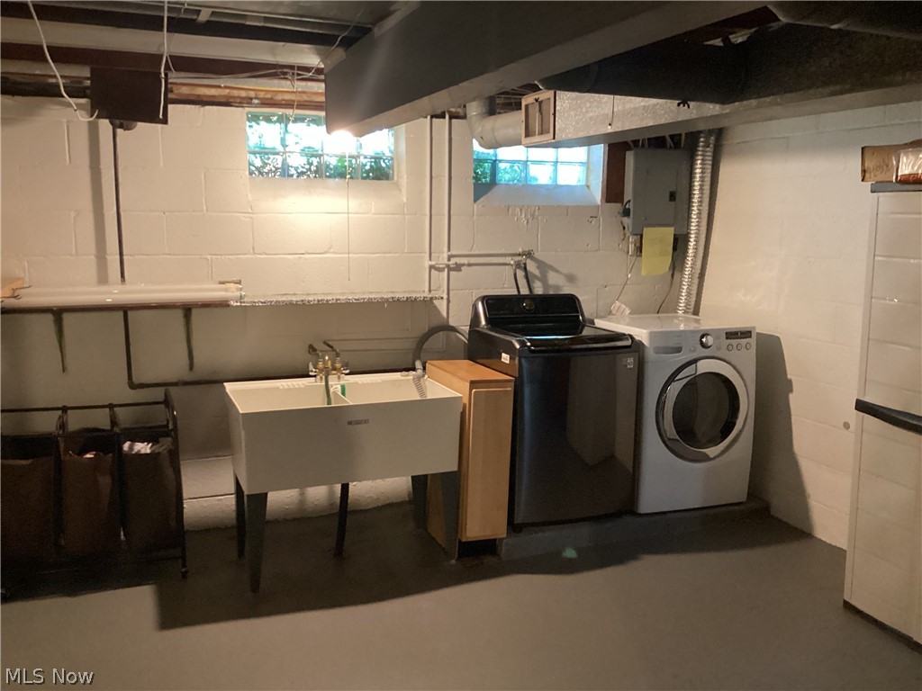 1559 Chelmsford Road Cleveland, OH 44124 - Photo 25 of 29 Clothes washing area with sink and washing machine and dryer