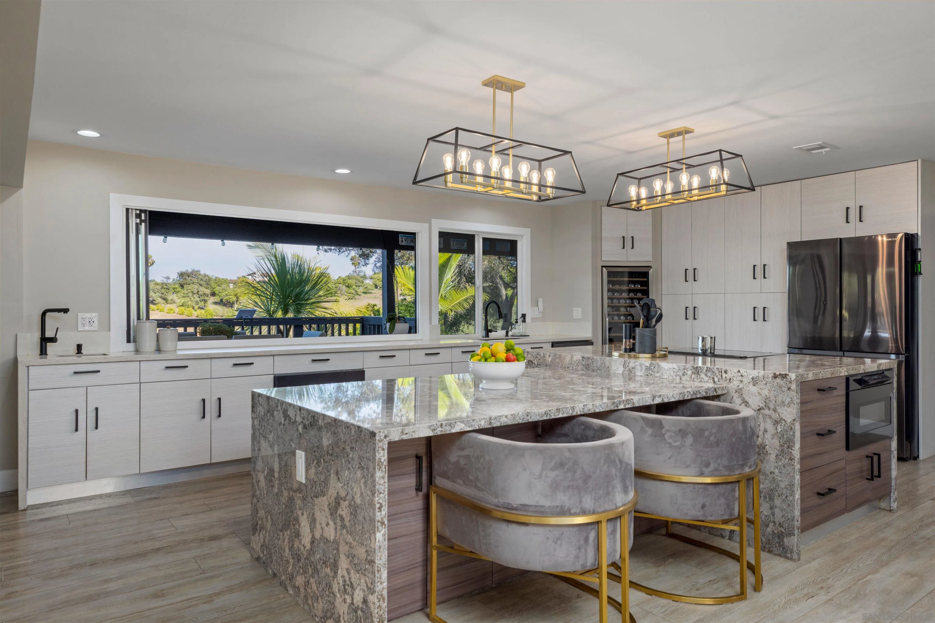 521 Rancho Camino Fallbrook, CA 92028 - Photo 13 of 72 a kitchen with sink cabinets and stainless steel appliances