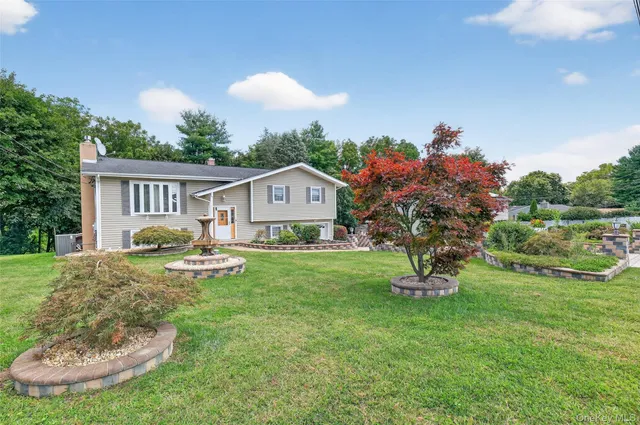 a view of a house with backyard porch and sitting area