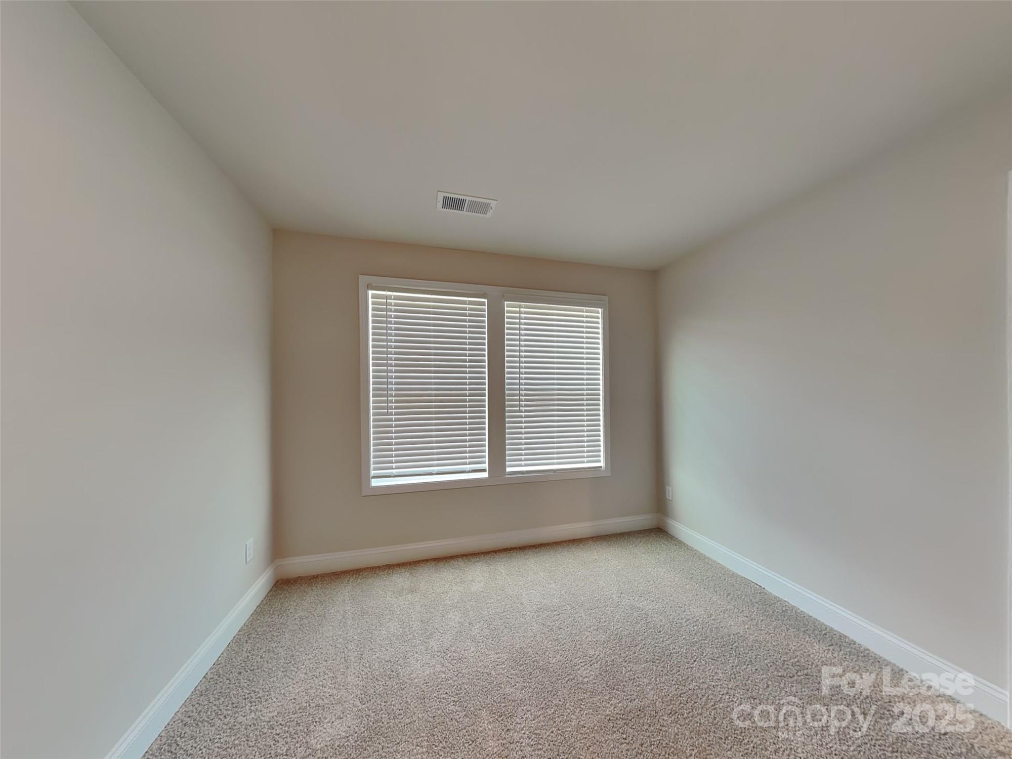 168 Queenshall Road Mooresville, NC 28117 - Photo 12 of 18 an empty room with a window