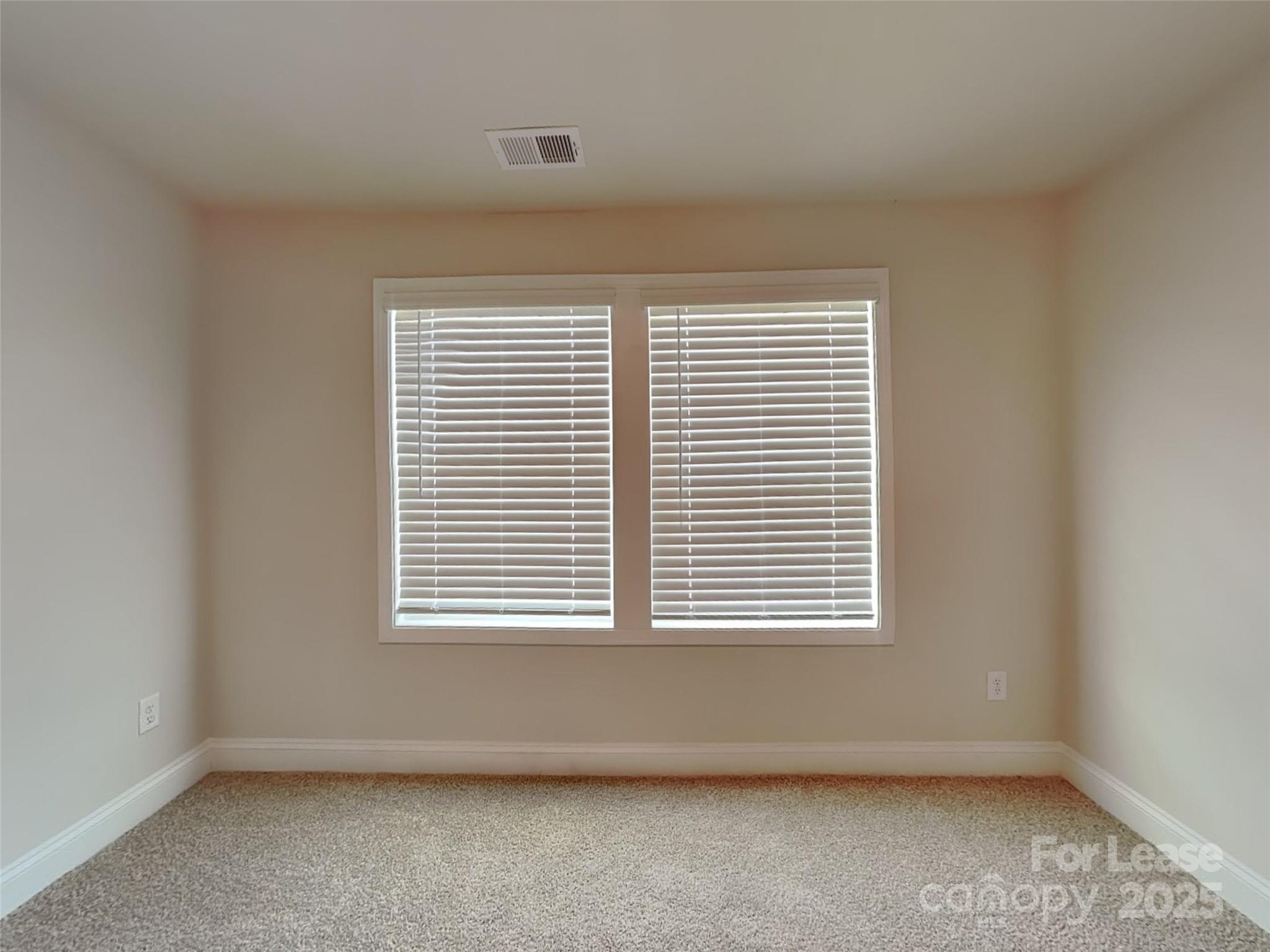 168 Queenshall Road Mooresville, NC 28117 - Photo 13 of 18 an empty room with a window