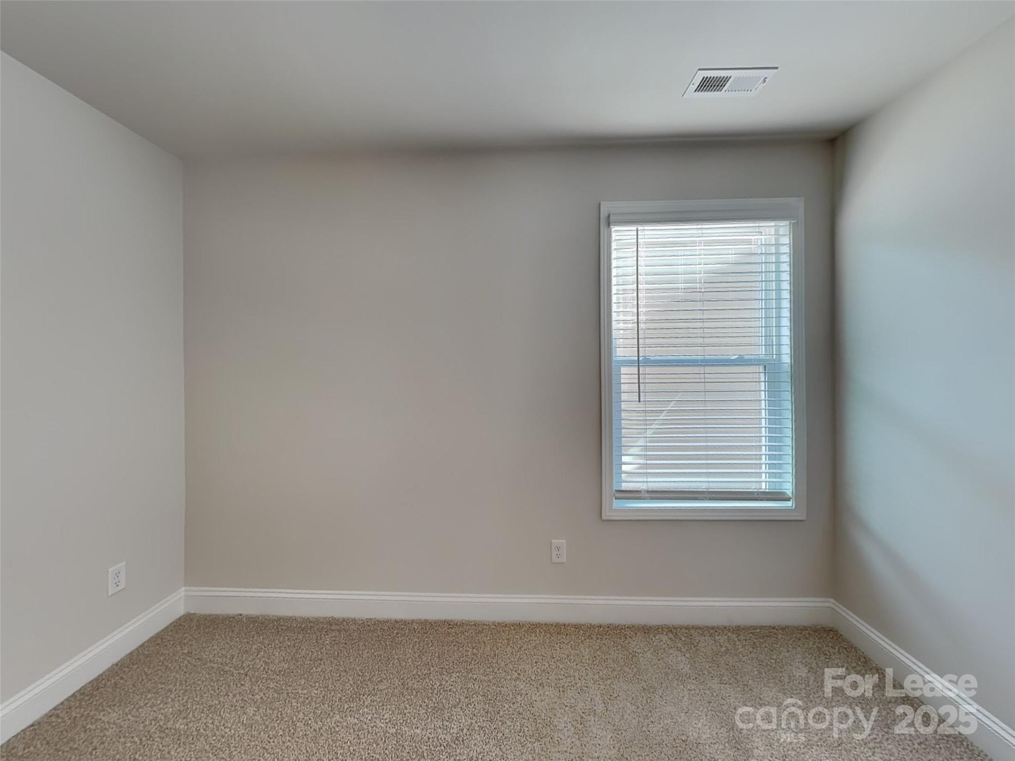 168 Queenshall Road Mooresville, NC 28117 - Photo 15 of 18 an empty room with a window