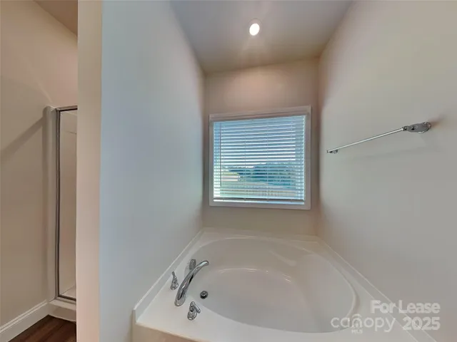 a white bath tub sitting in a bathroom