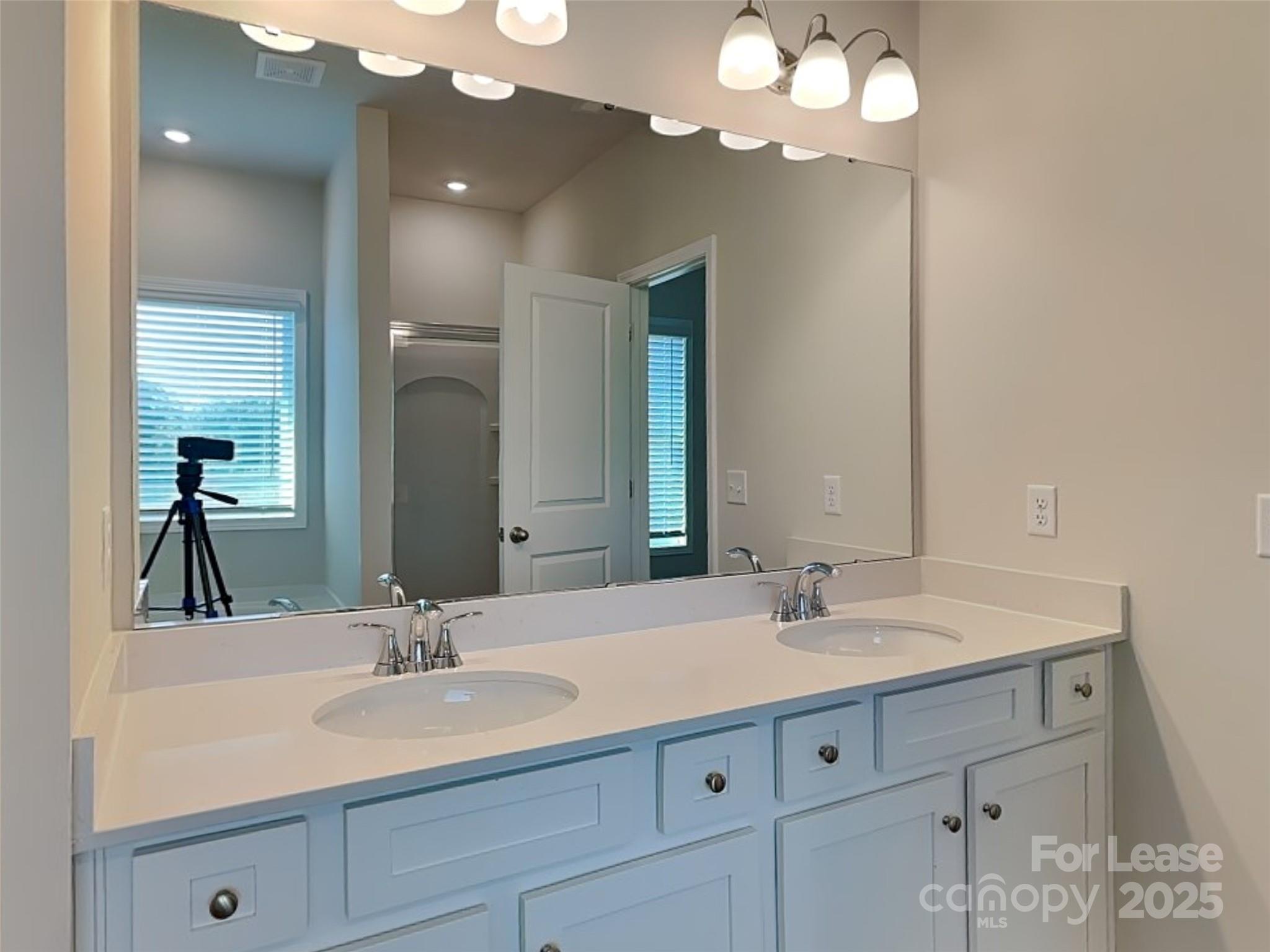 168 Queenshall Road Mooresville, NC 28117 - Photo 8 of 18 a bathroom with a sink vanity and a mirror
