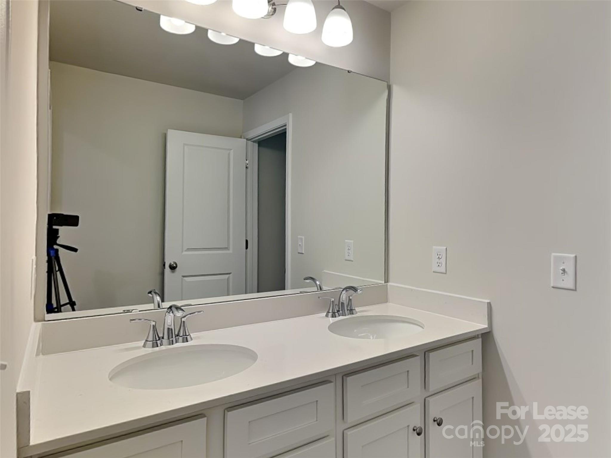 168 Queenshall Road Mooresville, NC 28117 - Photo 10 of 18 a bathroom with a sink and a mirror