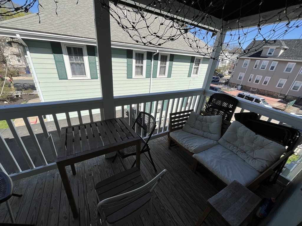 48 Sheffield Road, Unit 2 Boston, MA 02131 - Photo 12 of 18 a view of a balcony with chairs and wooden floor