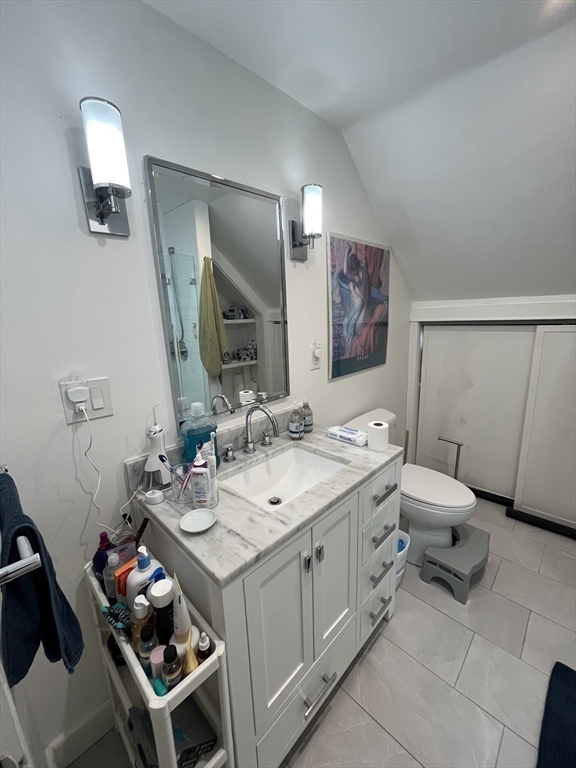 48 Sheffield Road, Unit 2 Boston, MA 02131 - Photo 14 of 18 a bathroom with a sink toilet and mirror