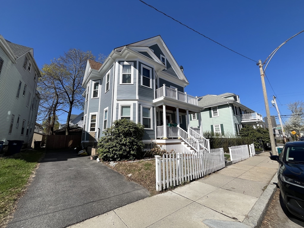 48 Sheffield Road, Unit 2 Boston, MA 02131 - Photo 2 of 18 a front view of a house with a garden