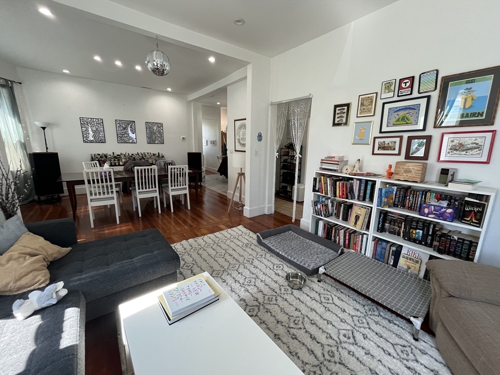 48 Sheffield Road, Unit 2 Boston, MA 02131 - Photo 9 of 18 a living room with furniture and a book shelf