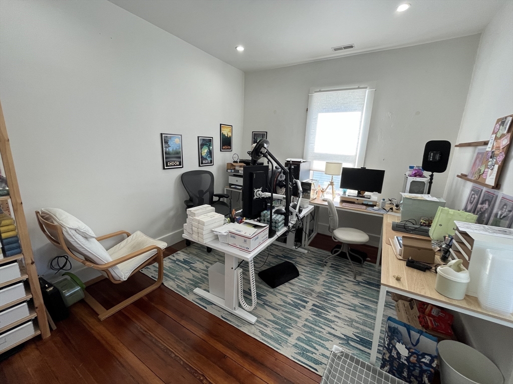 48 Sheffield Road, Unit 2 Boston, MA 02131 - Photo 10 of 18 a living room with furniture a rug and a wooden floor