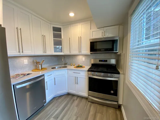 a kitchen with a stove and a microwave