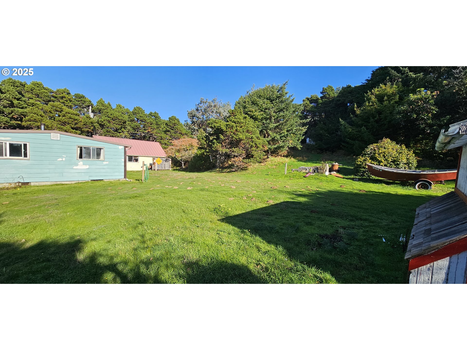 33261 Ophir Road Gold Beach, OR 97444 - Photo 3 of 36 a view of an outdoor space and a yard