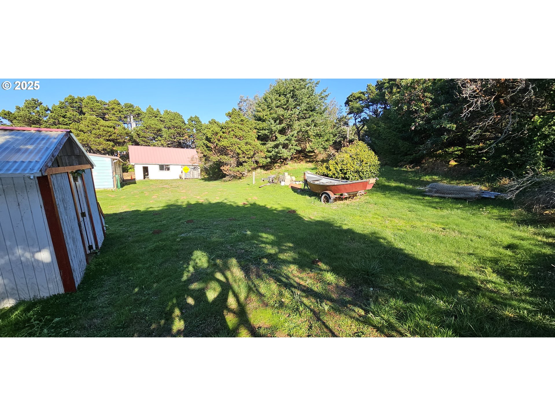 33261 Ophir Road Gold Beach, OR 97444 - Photo 32 of 36 a view of a back yard of the house