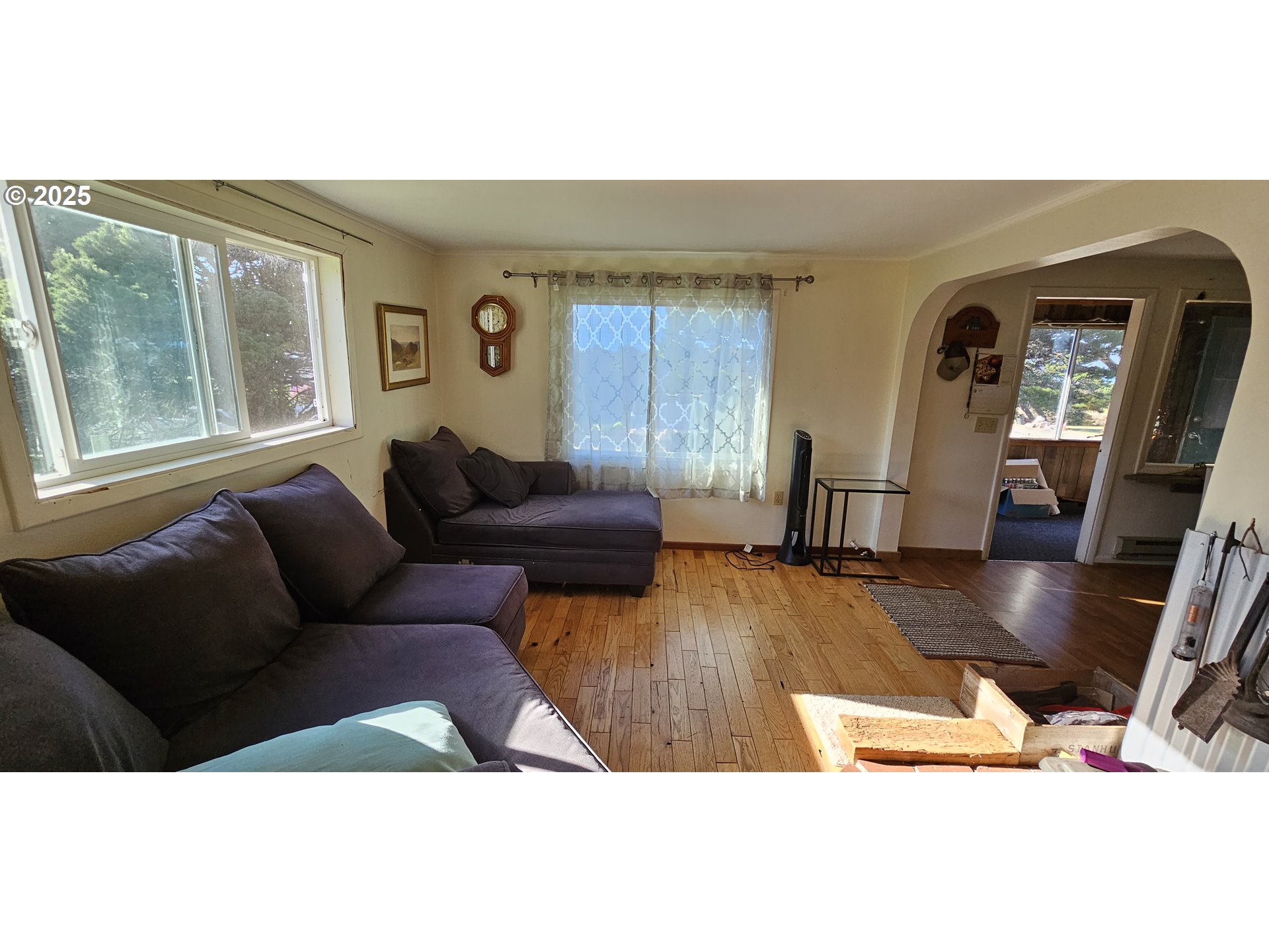 33261 Ophir Road Gold Beach, OR 97444 - Photo 9 of 36 a living room with furniture and a flat screen tv