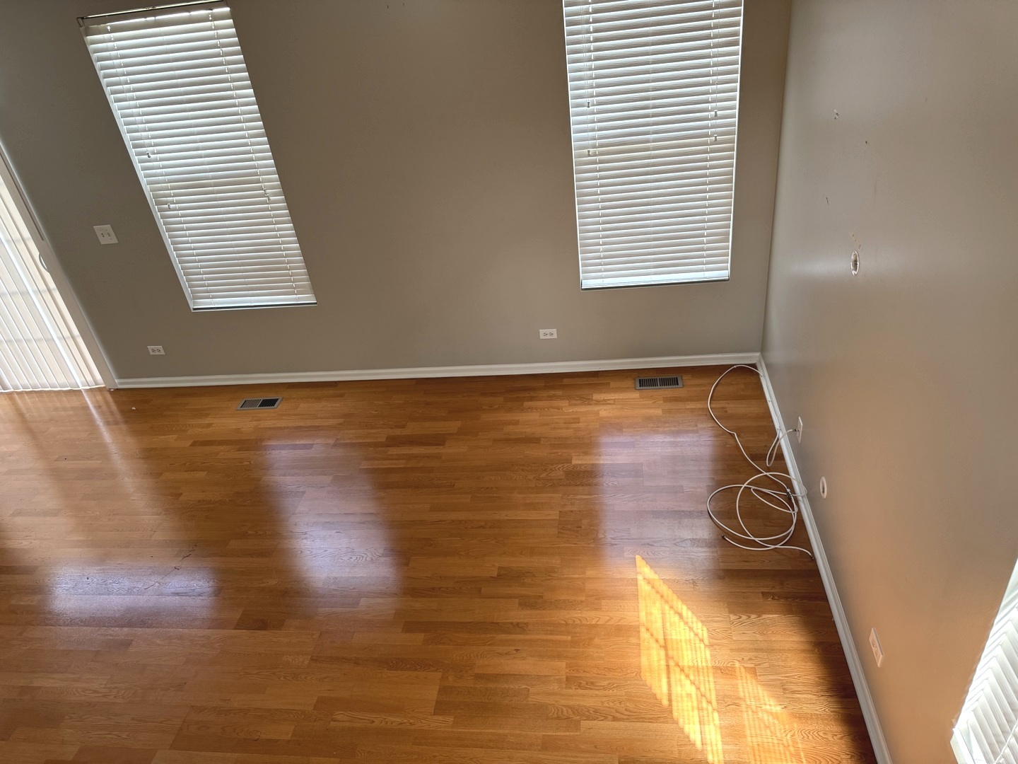 537 North Red Deer Road Round Lake, IL 60073 - Photo 3 of 12 a view of a room with wooden floor and a window