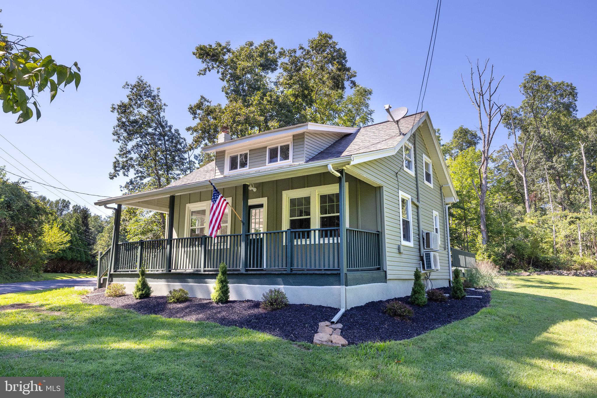 107 Rock Ridge Road Ottsville, PA 18942 - Photo 1 of 24 a view of an house with backyard and a tree