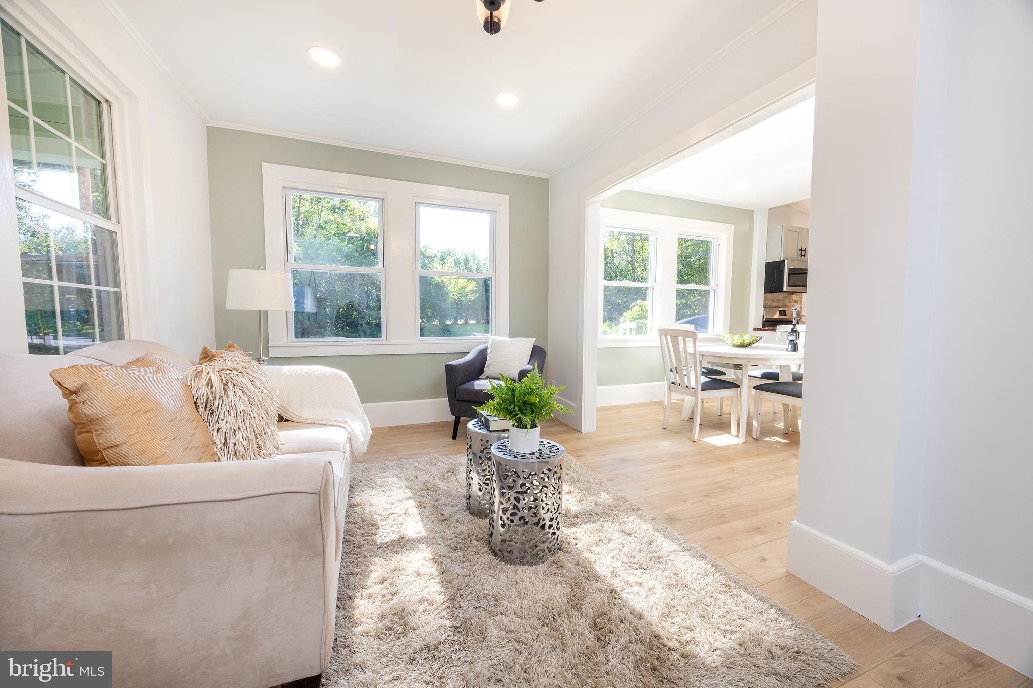 107 Rock Ridge Road Ottsville, PA 18942 - Photo 11 of 24 a living room with furniture large window and dining table