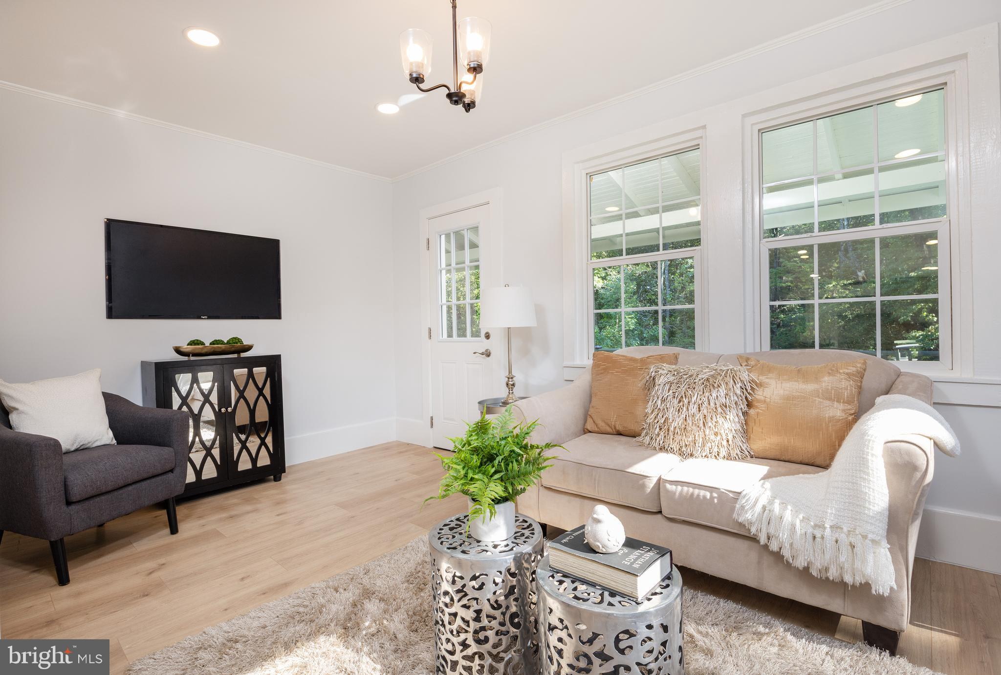 107 Rock Ridge Road Ottsville, PA 18942 - Photo 12 of 24 a living room with furniture and a flat screen tv