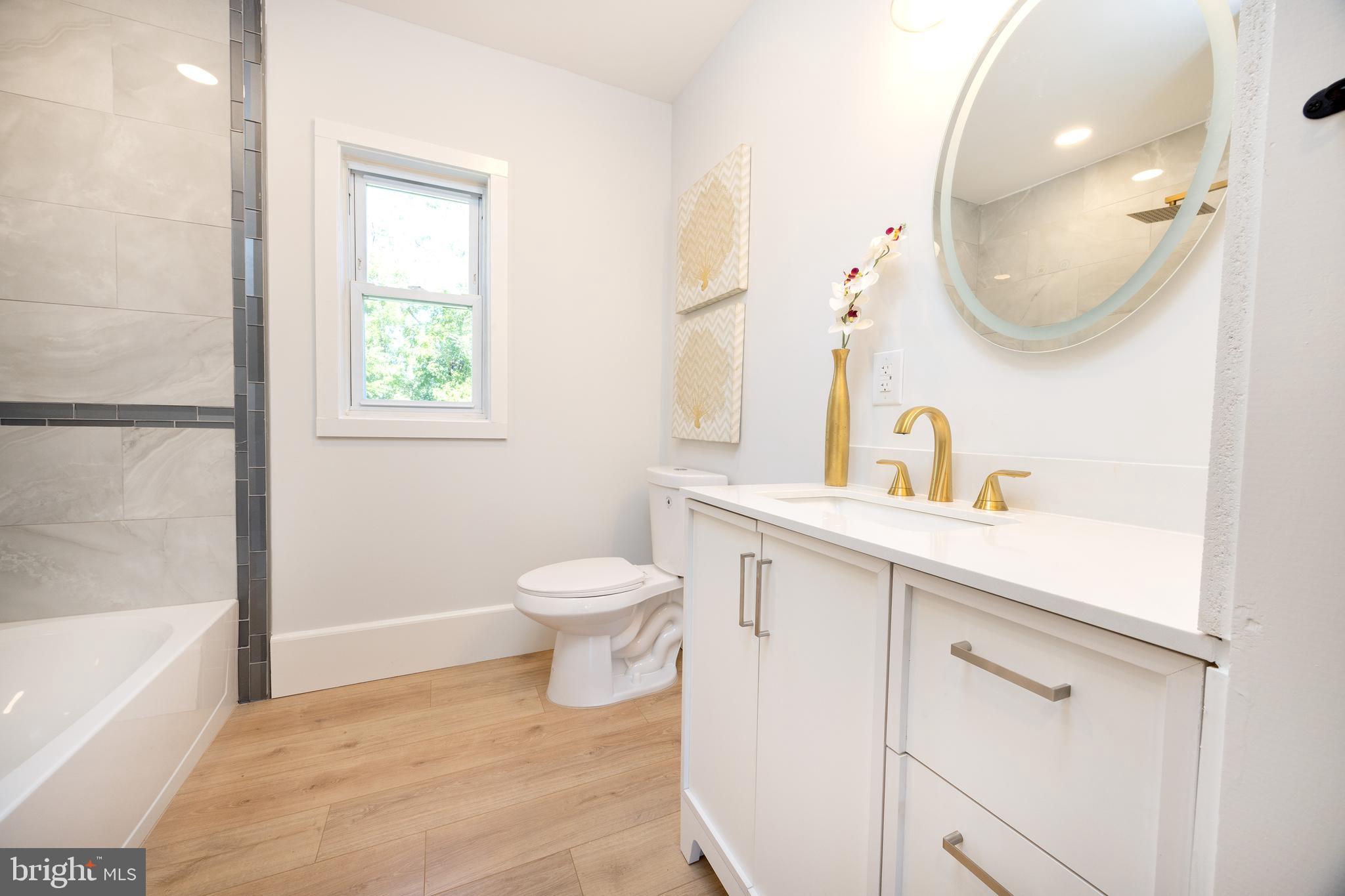 107 Rock Ridge Road Ottsville, PA 18942 - Photo 14 of 24 a bathroom with a sink a toilet and a mirror