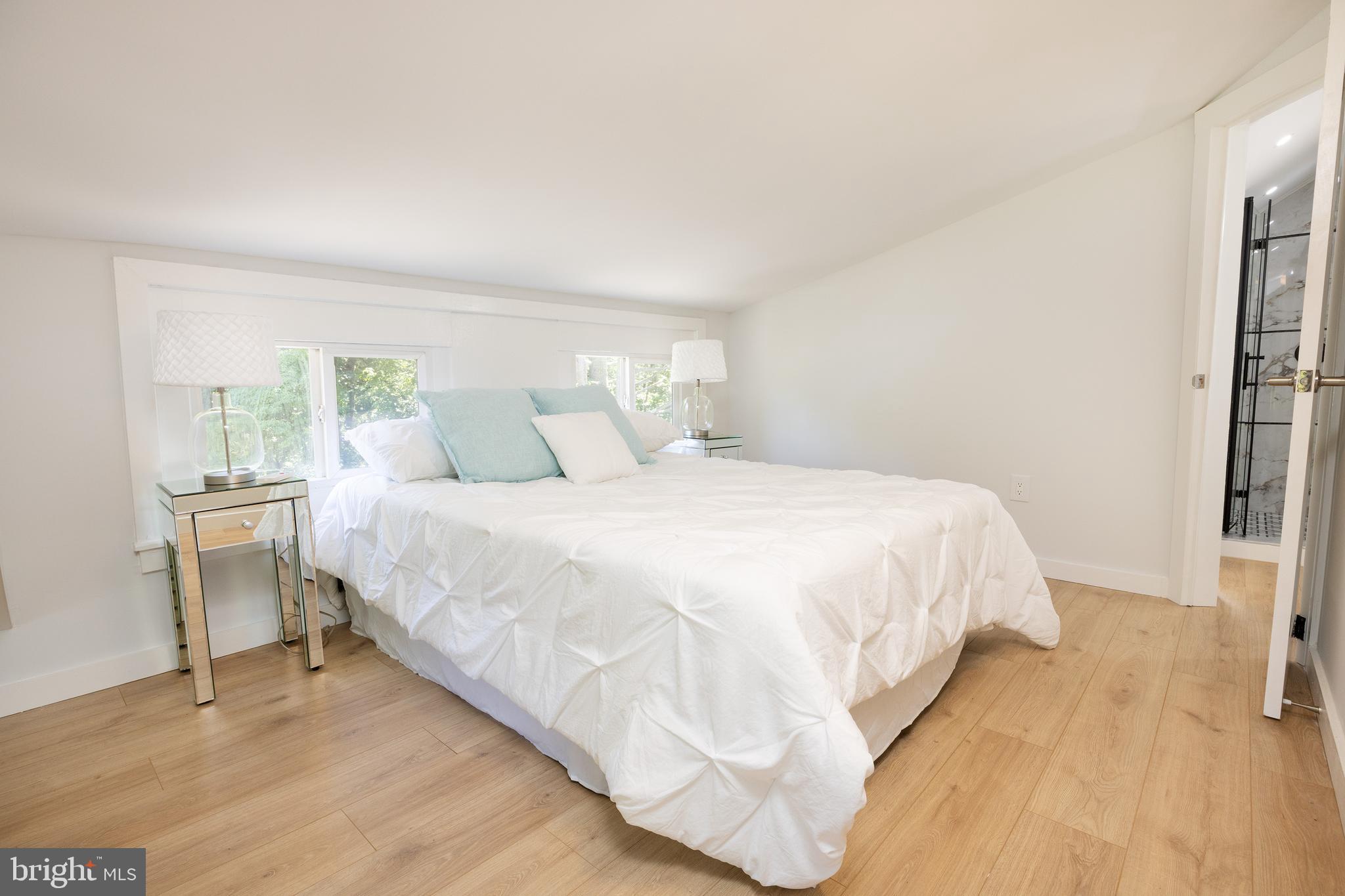 107 Rock Ridge Road Ottsville, PA 18942 - Photo 17 of 24 a bedroom with a bed and a large window