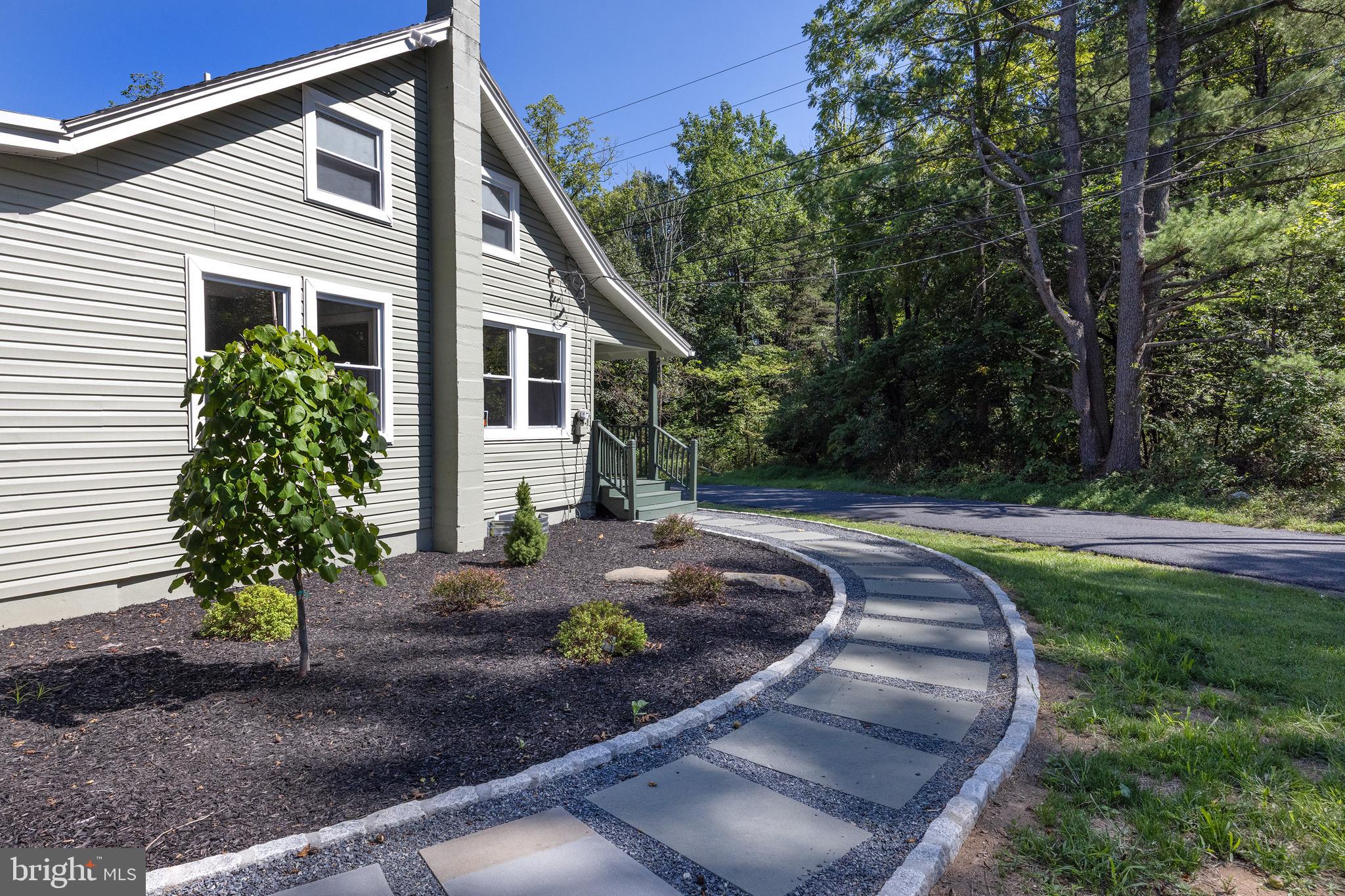 107 Rock Ridge Road Ottsville, PA 18942 - Photo 21 of 24 a front view of a house with garden