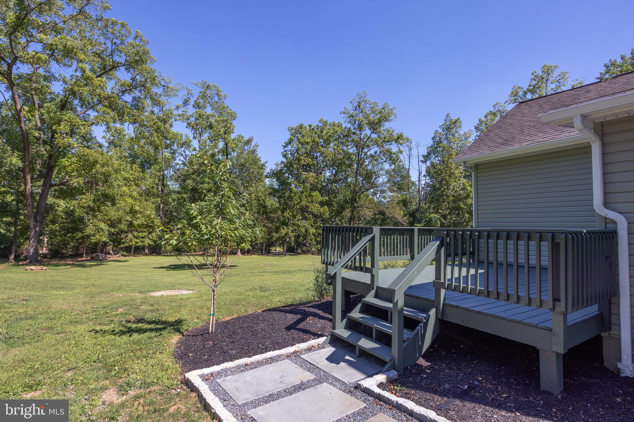 107 Rock Ridge Road Ottsville, PA 18942 - Photo 22 of 24 a view of a backyard with sitting area