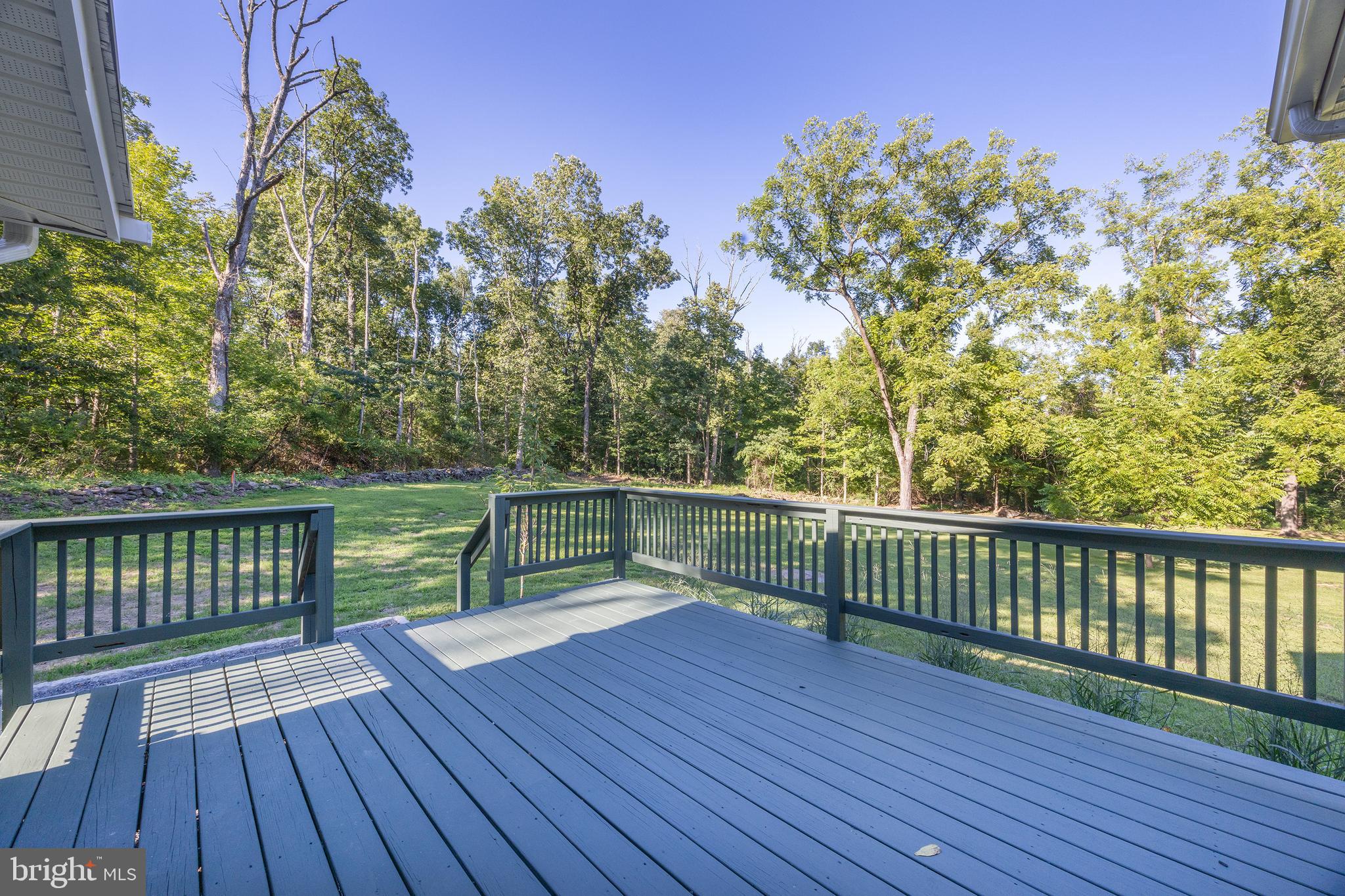 107 Rock Ridge Road Ottsville, PA 18942 - Photo 4 of 24 a view of balcony with wooden floor and fence